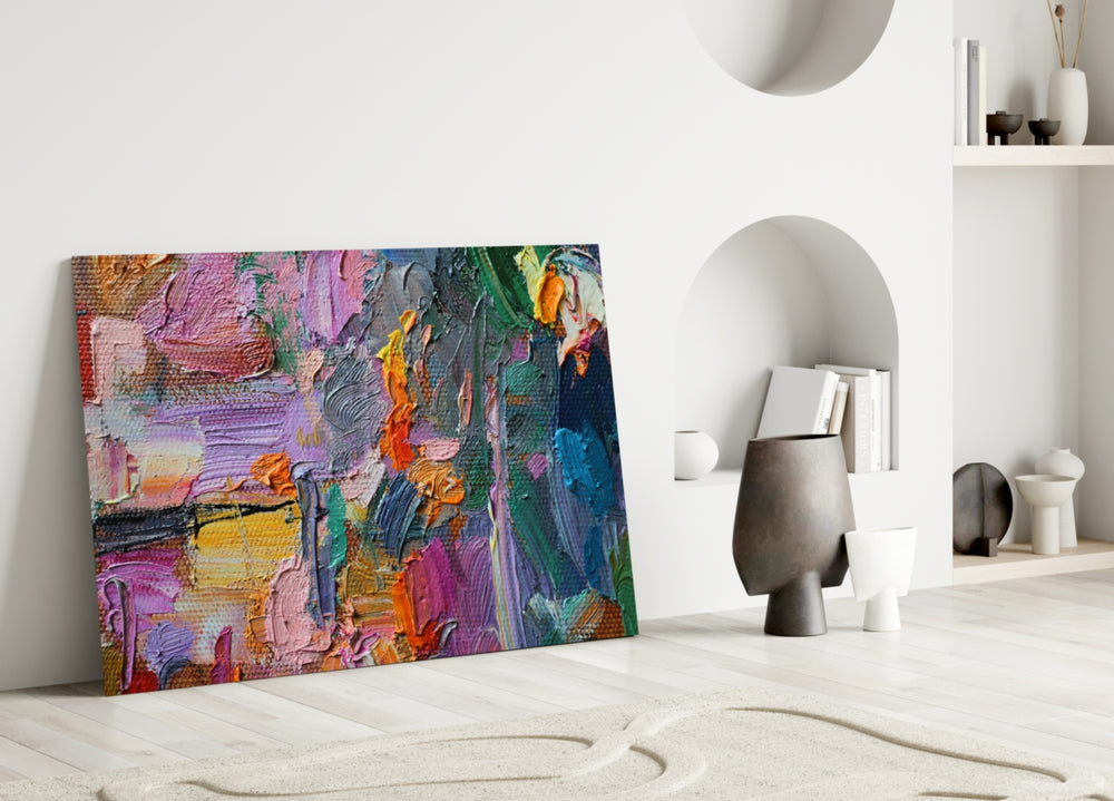 Abstract glass wall art styled above a sofa in a creative living room