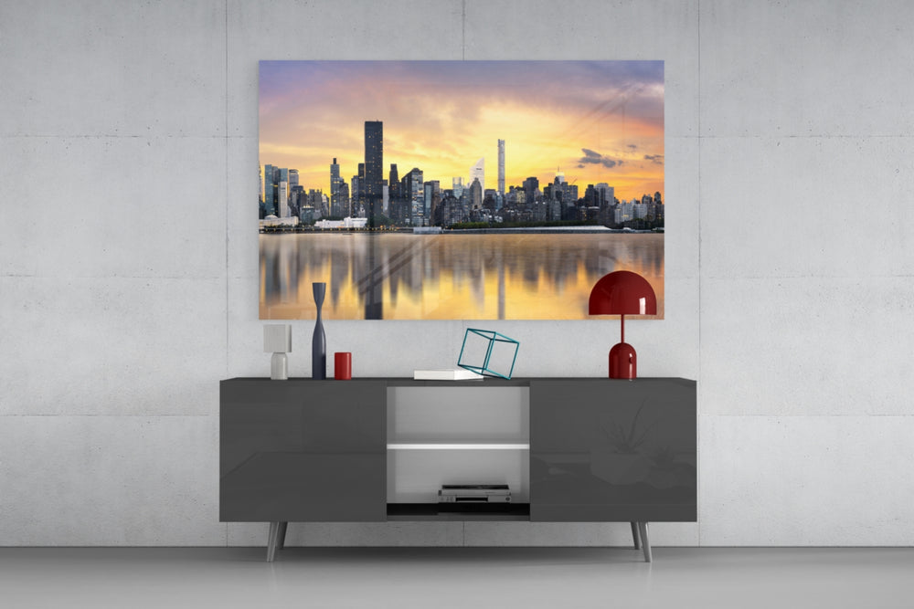 Fine art photography – impressive city skyline with high-rise buildings at golden hour, reflected symmetrically in still waterway below