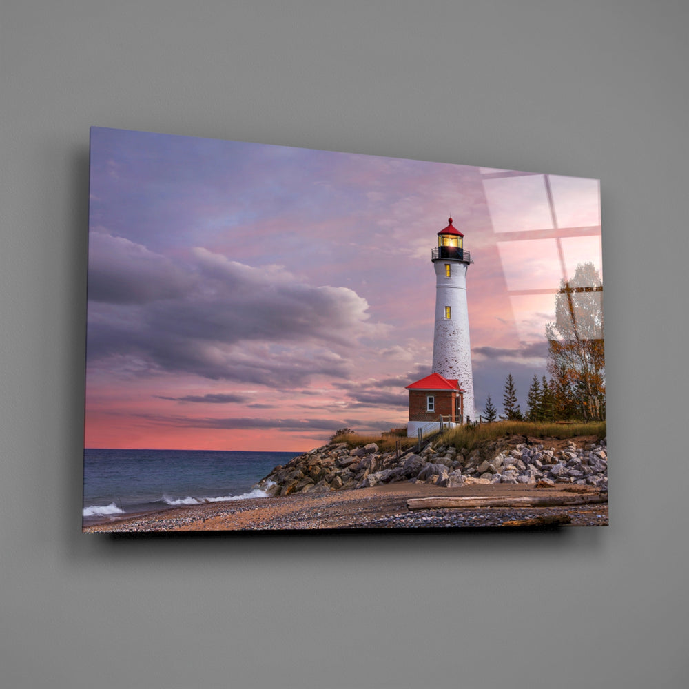Close-up detail of the white lighthouse against rose-and-mauve clouds