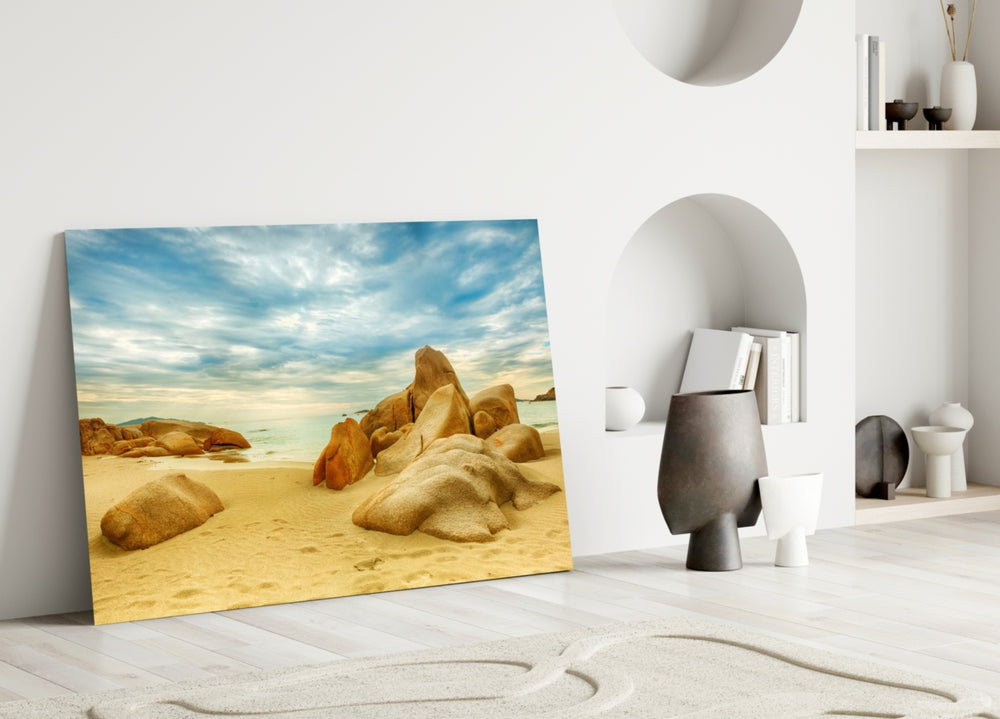 Beach glass wall art styled above a bed in a coastal-mood bedroom