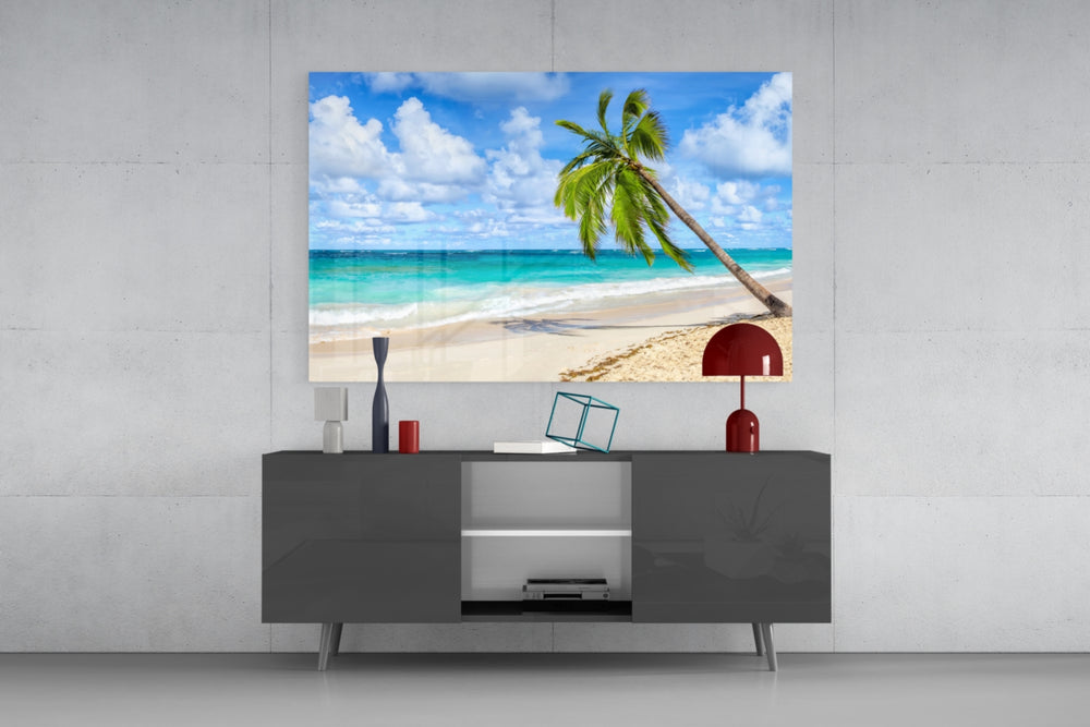 Fine art photography – solitary leaning palm tree on pristine tropical white sand beach with vivid turquoise ocean and blue sky
