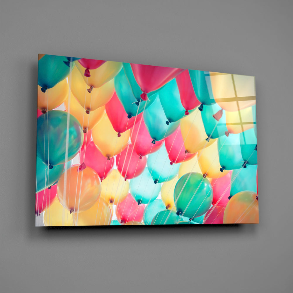 Close-up detail of the multicolor balloon canopy with trailing strings