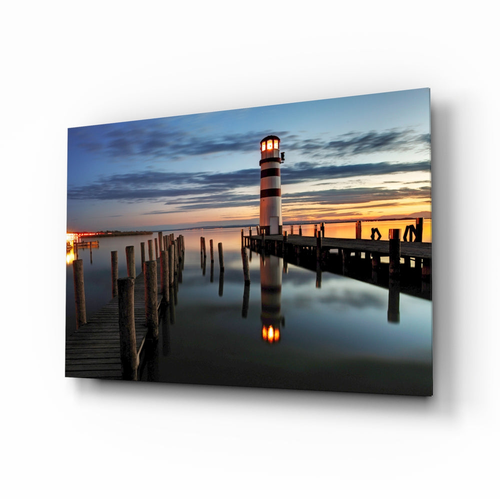 Lighthouse sunset panel bringing coastal calm to a contemporary living space