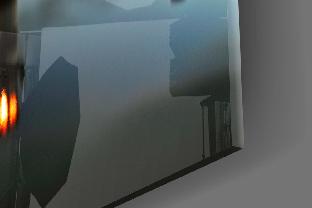 Lighthouse panel catching evening light to reveal its mirrored reflection