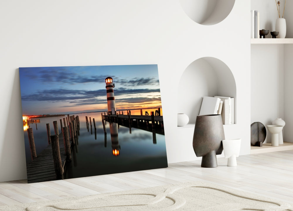 Lighthouse glass wall art styled above a bed in a nautical bedroom
