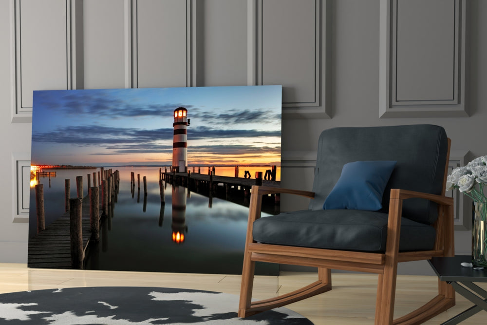 Lighthouse artwork anchoring a dining area with sunset warmth