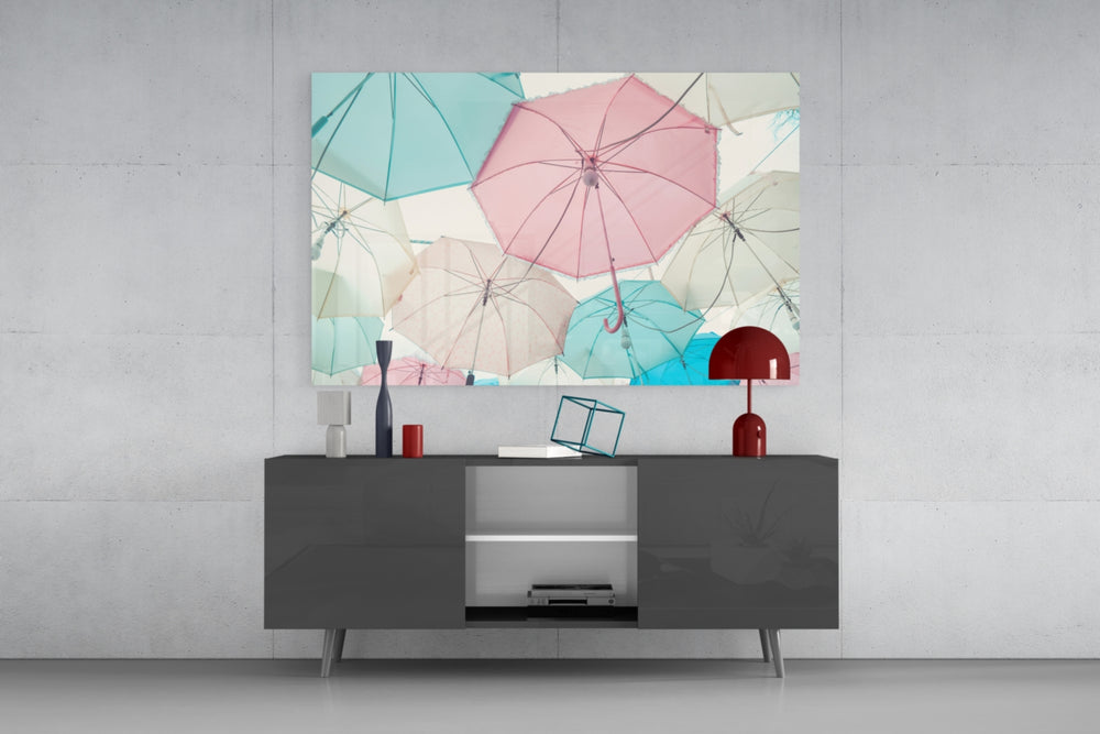 Fine art photography – arrangement of pastel umbrellas in pink, mint and white viewed from below, creating a soft dreamy canopy effect