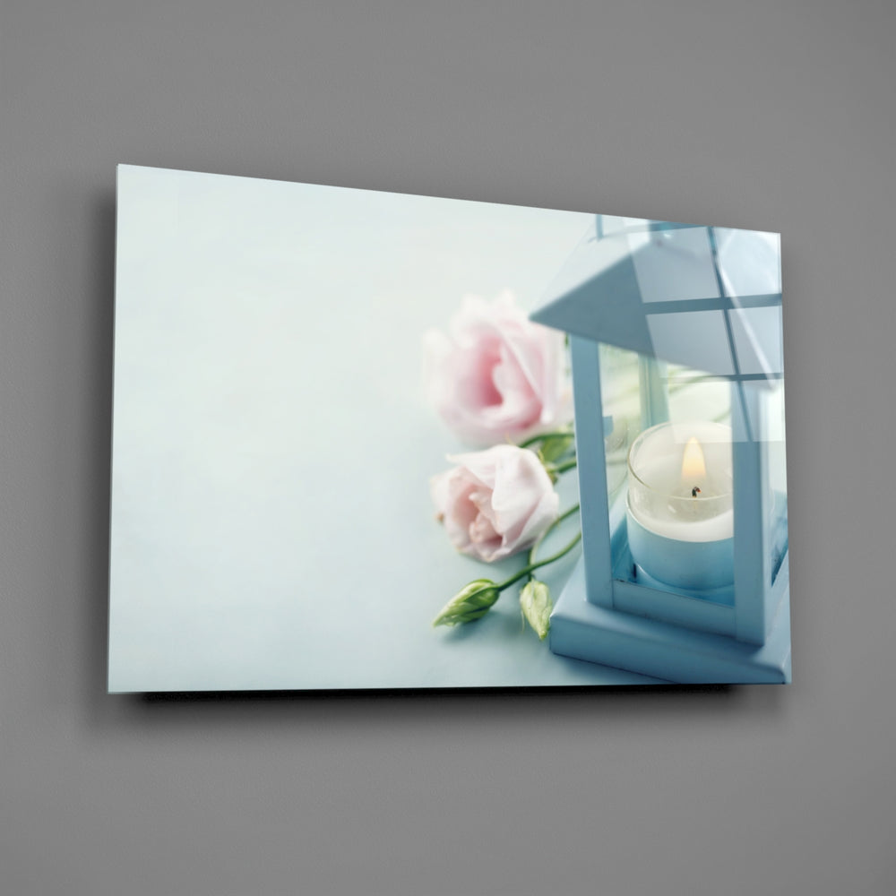 Close-up detail of the blue lantern candle and pink roses