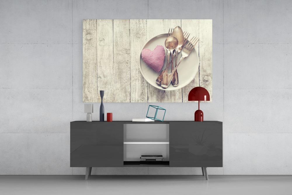 Fine art still life – white plate with vintage silver cutlery and red textile heart on pale weathered rustic wood plank surface