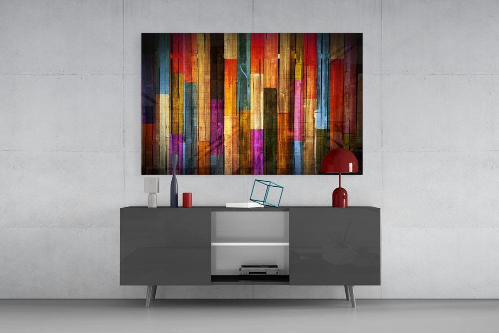 Fine art abstract – vertical wood planks painted in vivid multicolor stripes of red, blue, orange, purple, teal and yellow with visible wood grain