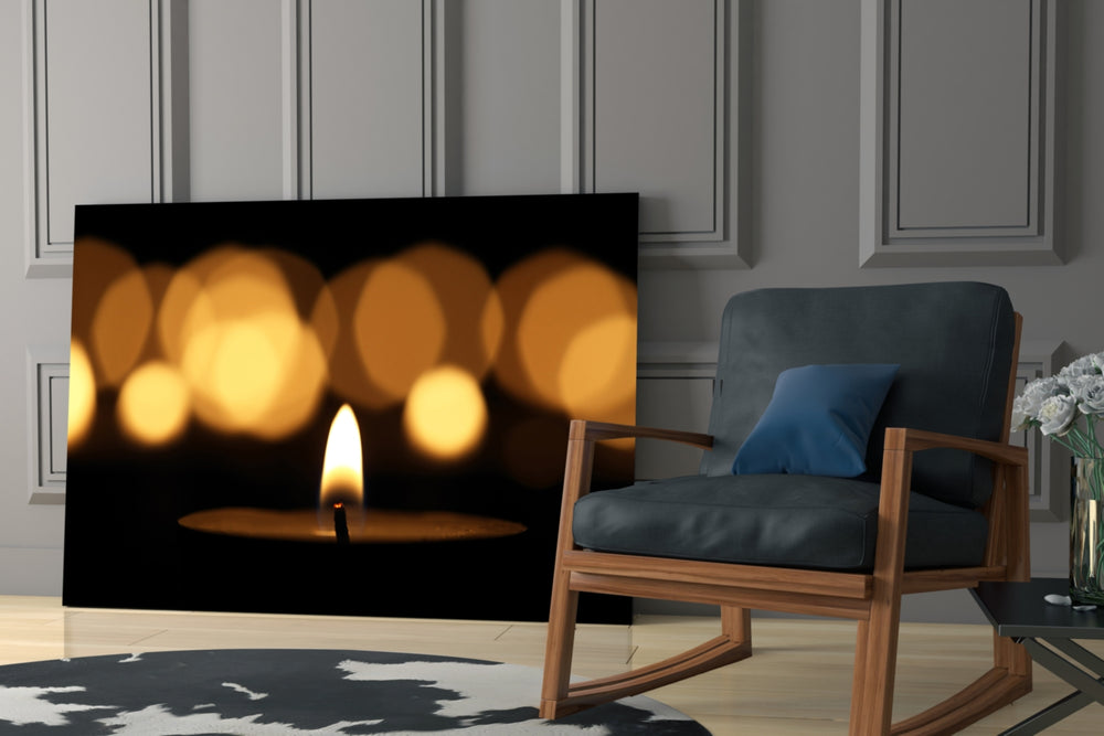 Candle glass print anchoring a bar with low-light warmth