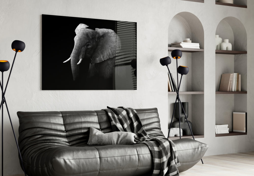 Elephant glass wall art styled above a sofa in a bold living room