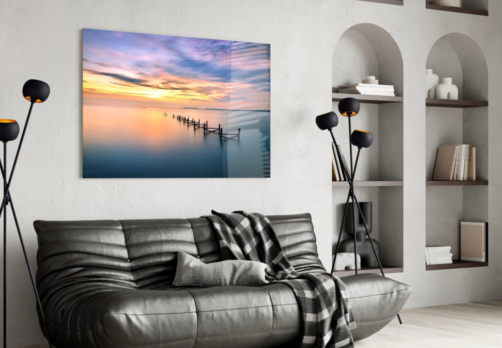 Sunset glass wall art styled above a bed in a poetic bedroom