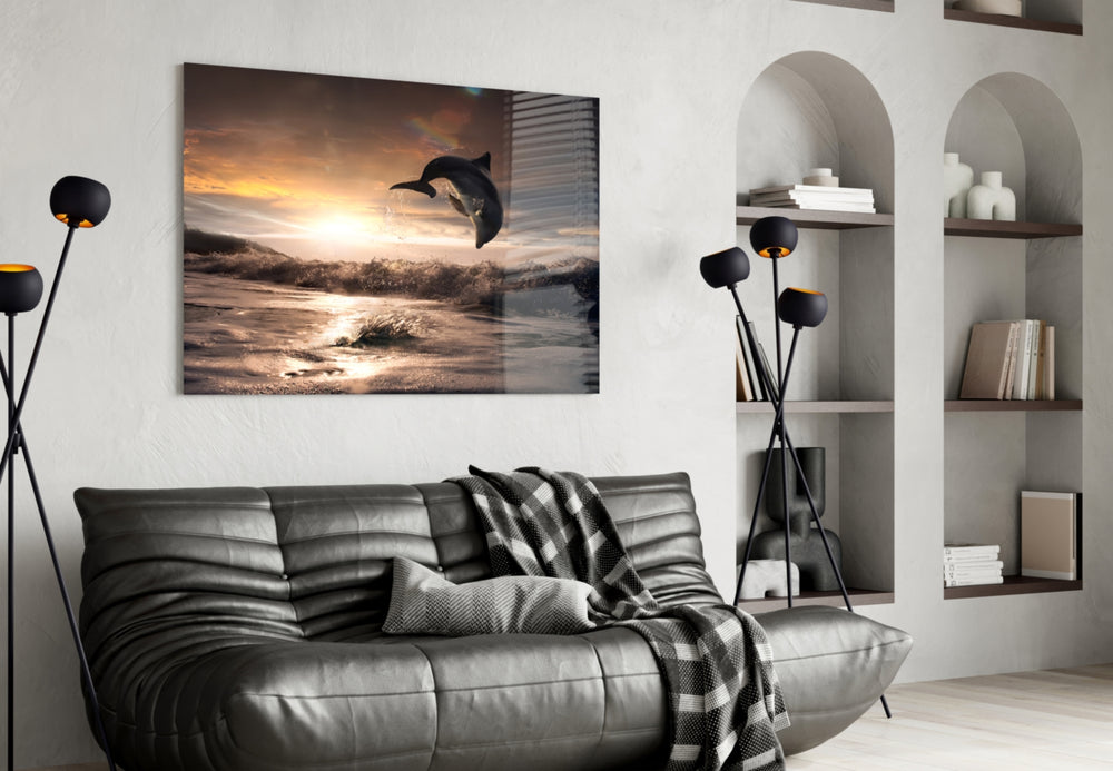 Dolphin glass wall art styled above a bed in an ocean-mood bedroom