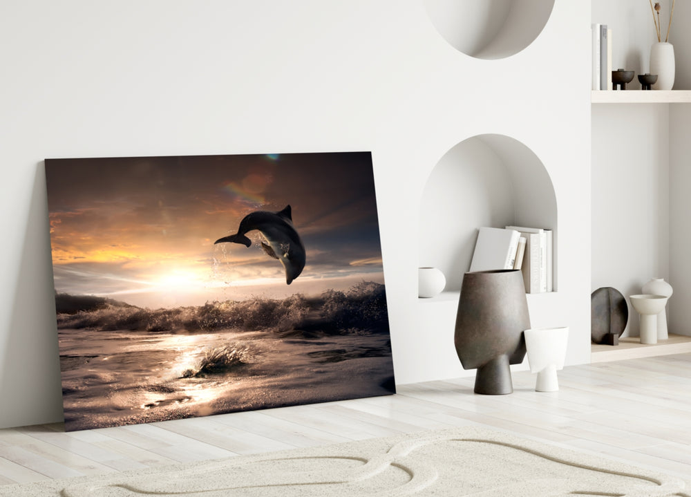 Close-up detail of the dolphin arcing above sunset ocean waves