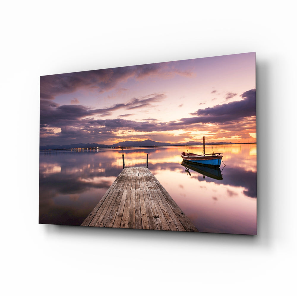 Dock twilight boat glass wall art displayed above a console in a designer interior