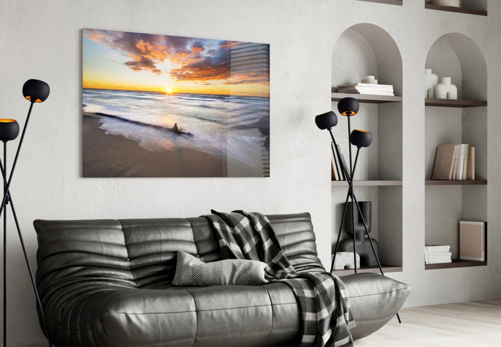 Sunset glass wall art styled above a bed in a coastal bedroom