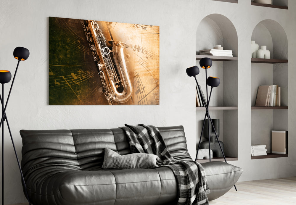 Saxophone glass wall art styled above a sofa in a music-lover lounge