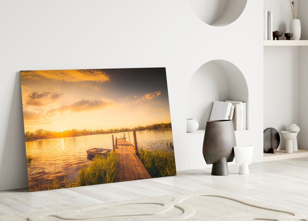 Close-up detail of the rustic dock and rowboat at sunset