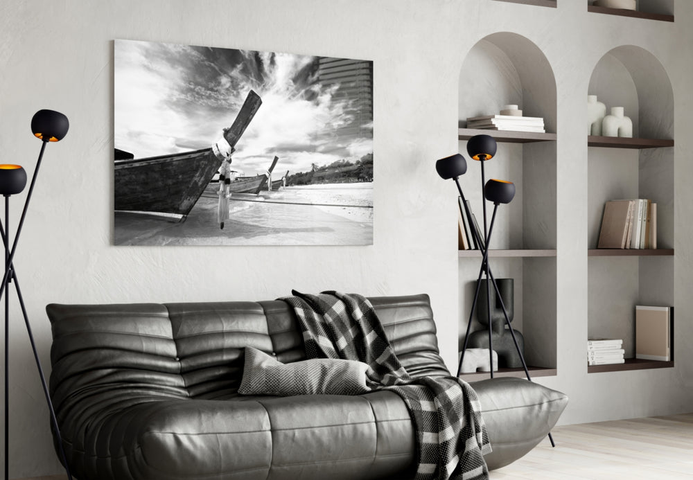 Boats on the Beach glass wall art styled above a sofa in a global-adventure living room