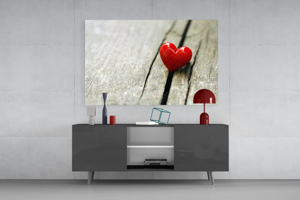 Heart panel catching soft light to reveal its lacquered red shine