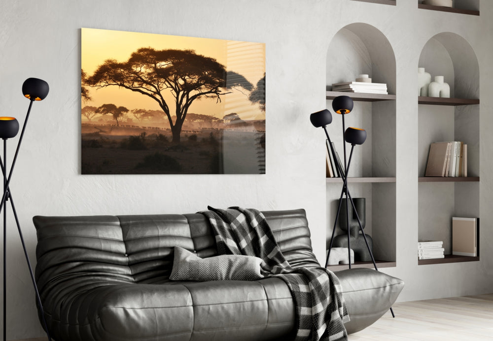 Tree glass wall art styled above a sofa in a global-adventure living room