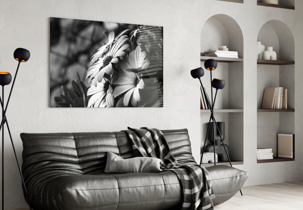 Black-White Flower glass wall art styled above a bed in a graphic-mood bedroom