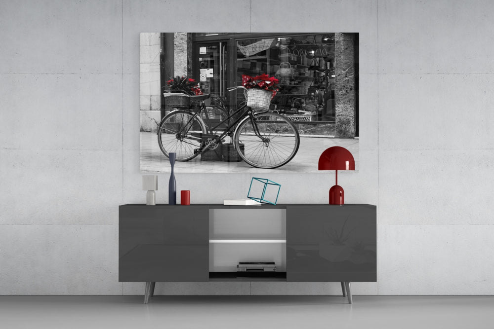 Bicycle panel catching warm light to reveal its red flower accent