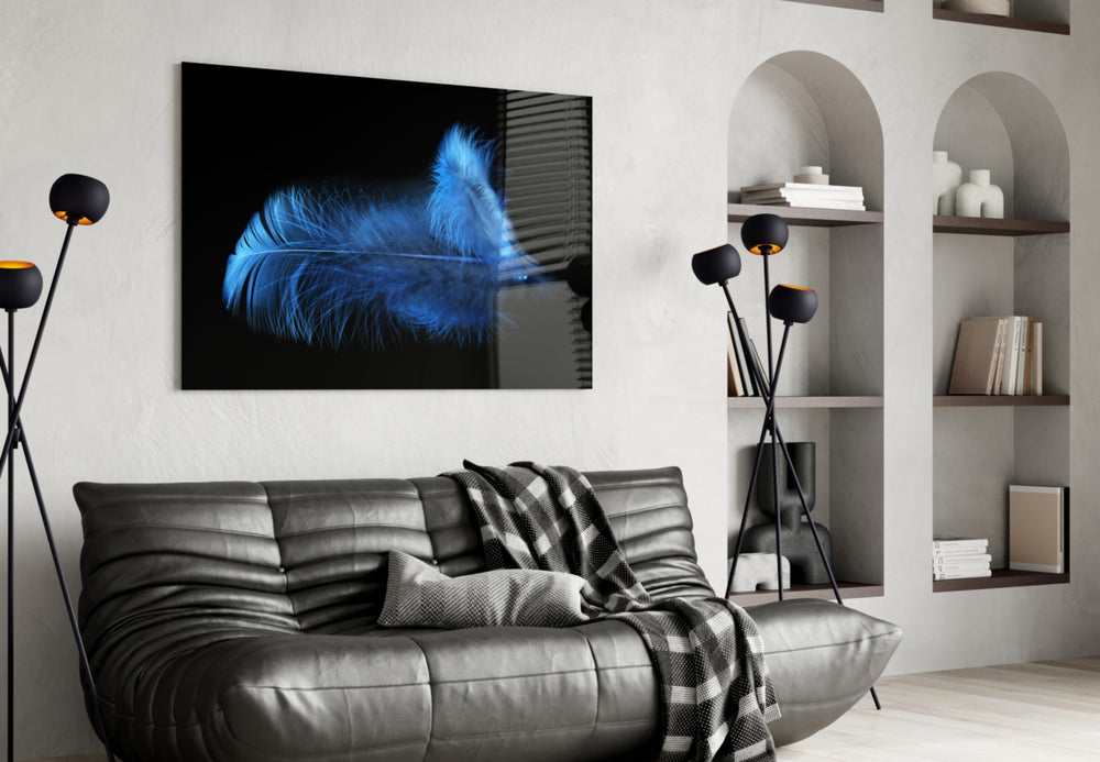 Blue Feather glass wall art styled above a bed in a serene bedroom