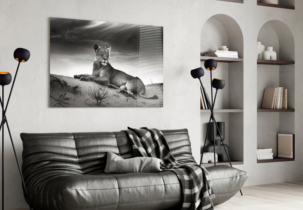 Lioness glass wall art styled above a sofa in a safari-taste living room
