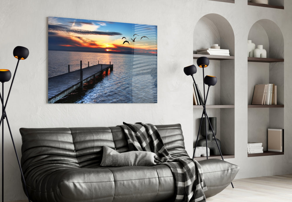 Dock glass wall art styled above a sofa in a statement-color living room
