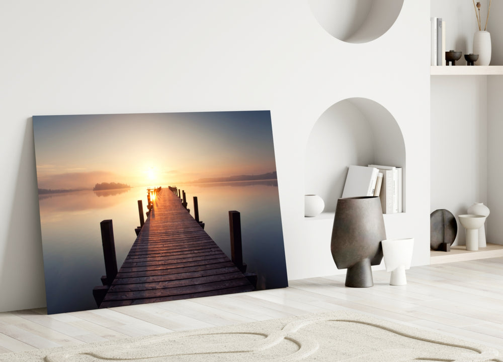 Close-up detail of the wooden pier leading toward sunrise