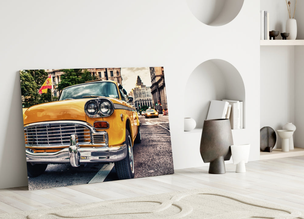 Close-up detail of the yellow Checker cab and Manhattan street