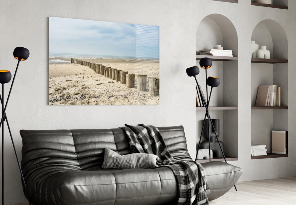 Beach glass wall art styled above a bed in a seaside retreat bedroom