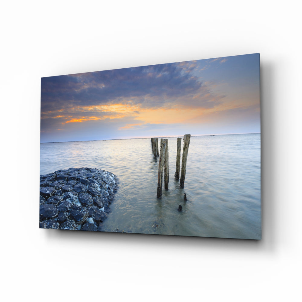 Sunset glass wall art displayed above a console in a designer interior