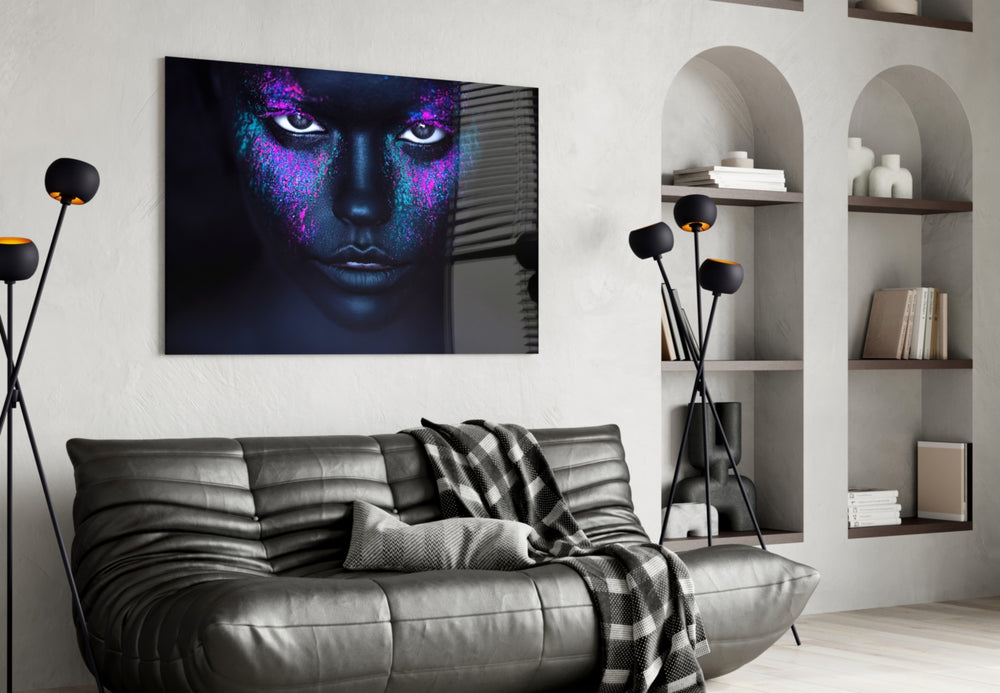 Woman Portrait glass wall art styled above a bed in an editorial-mood bedroom