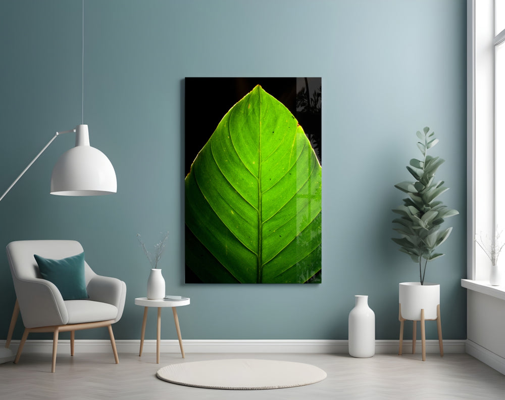 Green Leaf glass wall art styled above a bed in a biophilic bedroom