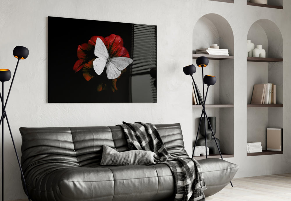 Butterfly glass wall art styled above a bed in a statement-mood bedroom