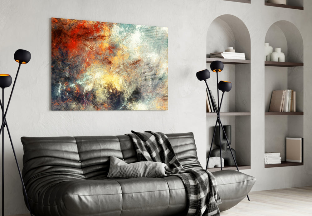 Abstract glass wall art styled above a sofa in a statement-color living room