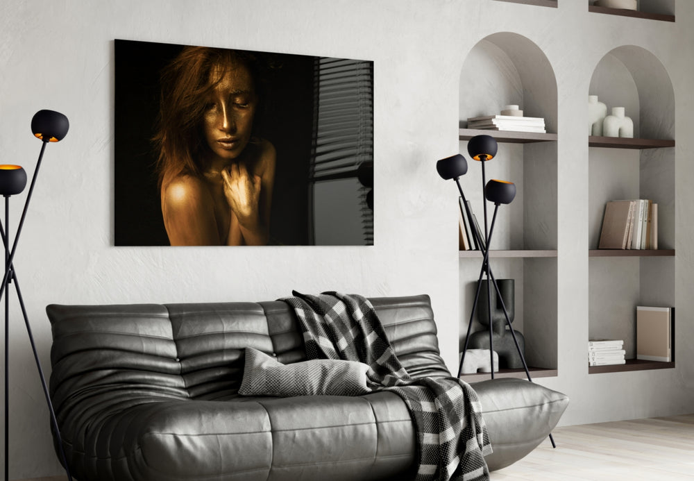 Woman glass wall art styled above a bed in an introspective bedroom