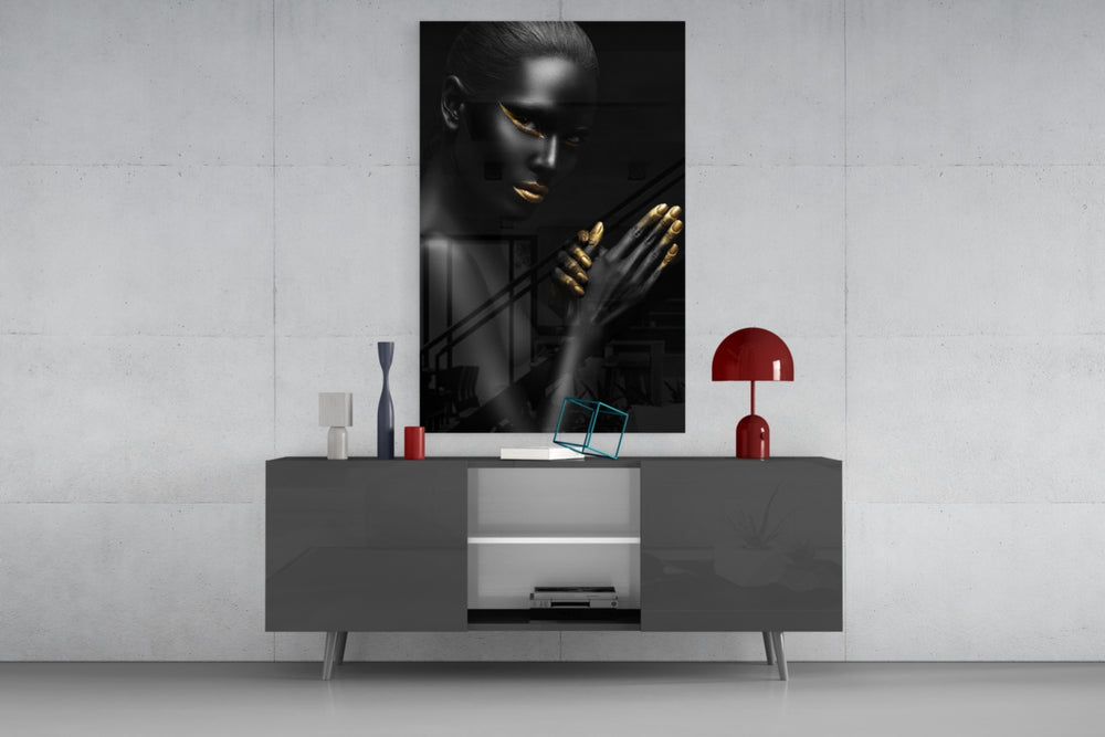 Woman artwork anchoring a lounge with metallic accents