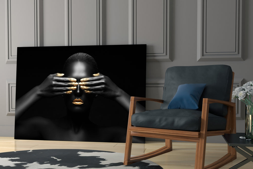 Woman glass wall art styled above a bed in an introspective bedroom