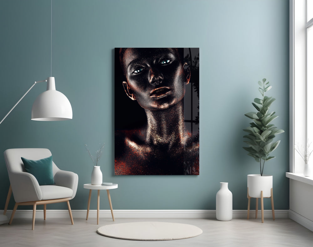 Woman glass wall art styled above a bed in a moody bedroom