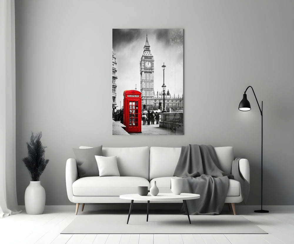 Close-up detail of the red phone box against black-and-white Big Ben