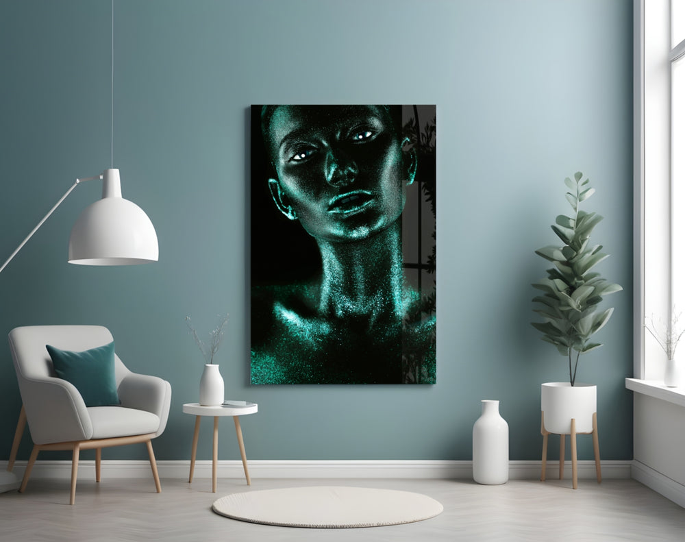 Woman glass wall art styled above a bed in a coastal-mood bedroom