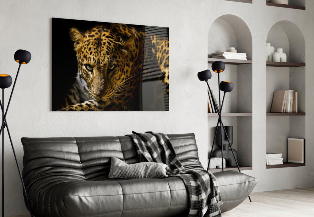 Leopar glass wall art styled above a sofa in a safari-lounge living room