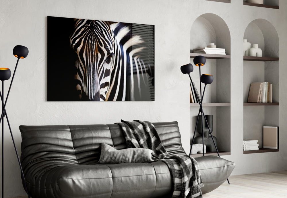 Zebra glass wall art styled above a sofa in a safari-mood living room