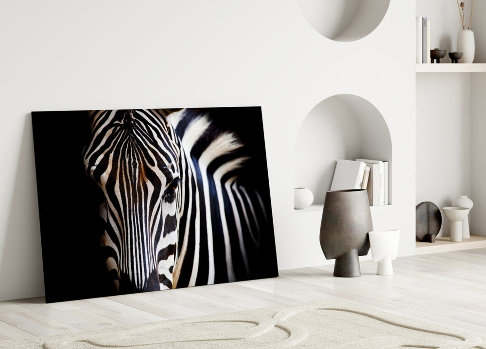 Close-up detail of the zebra's flowing stripes and dark eye