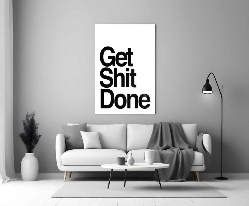 Get Shit Done glass wall art catching light to reveal its high-contrast typography