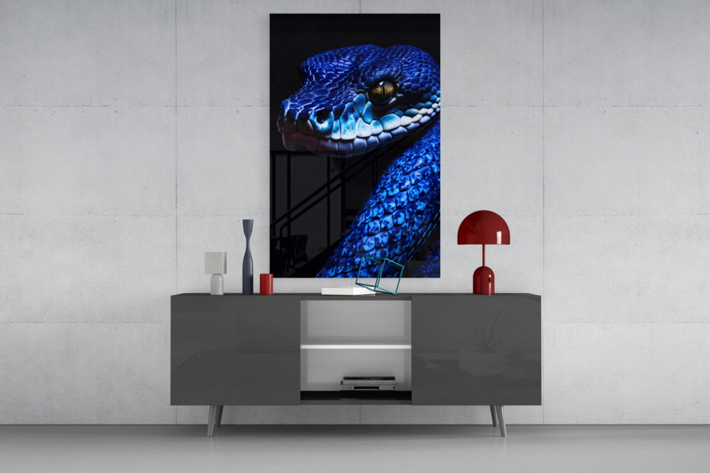 Blue Viper glass wall art catching light to reveal its scale gleam